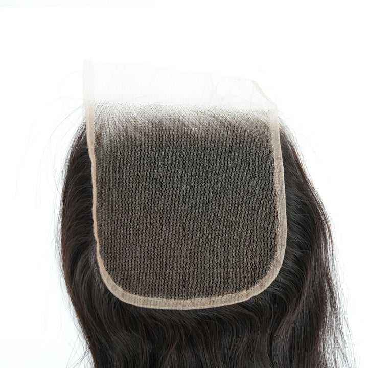 Close-up of a hairpiece with a mesh back on a white background