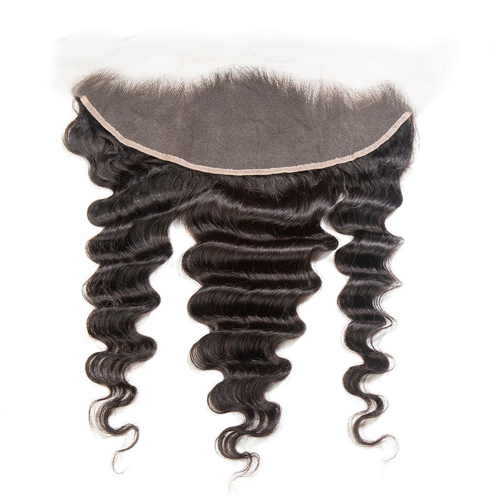A bundle of loose, deep black loose deep hair extensions with a transparent lace frontal and small knots.